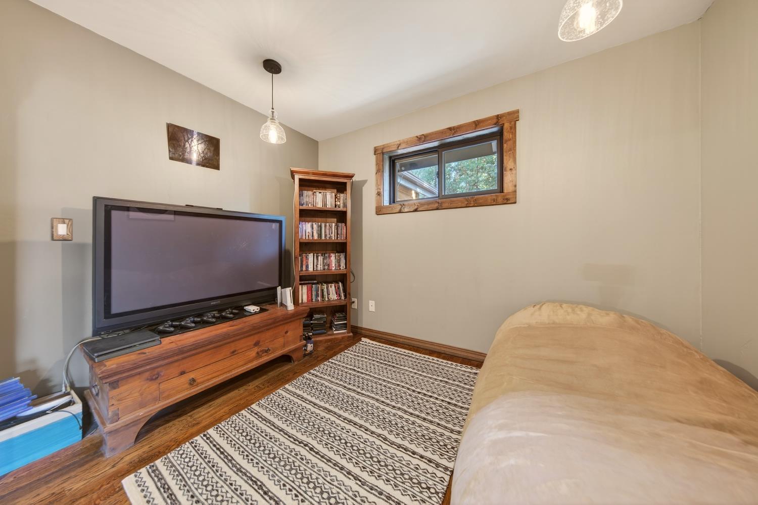 11234 Valencia Road Nevada City, CA 95959 - Photo 41 of 62 a living room with furniture and a flat screen tv