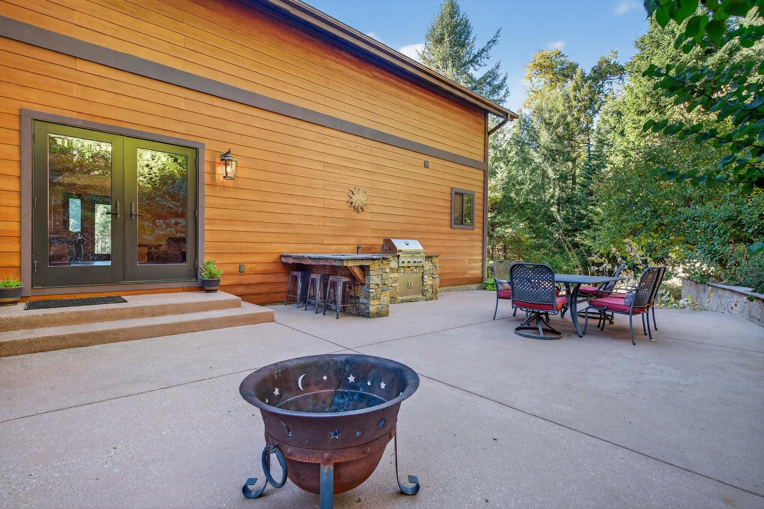 11234 Valencia Road Nevada City, CA 95959 - Photo 48 of 62 a view of a patio with table and chairs and potted plants