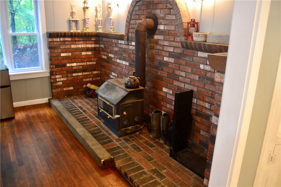 14 Slavin Path Glocester, RI 02814 - Photo 14 of 36 Brick-backed wood stove
