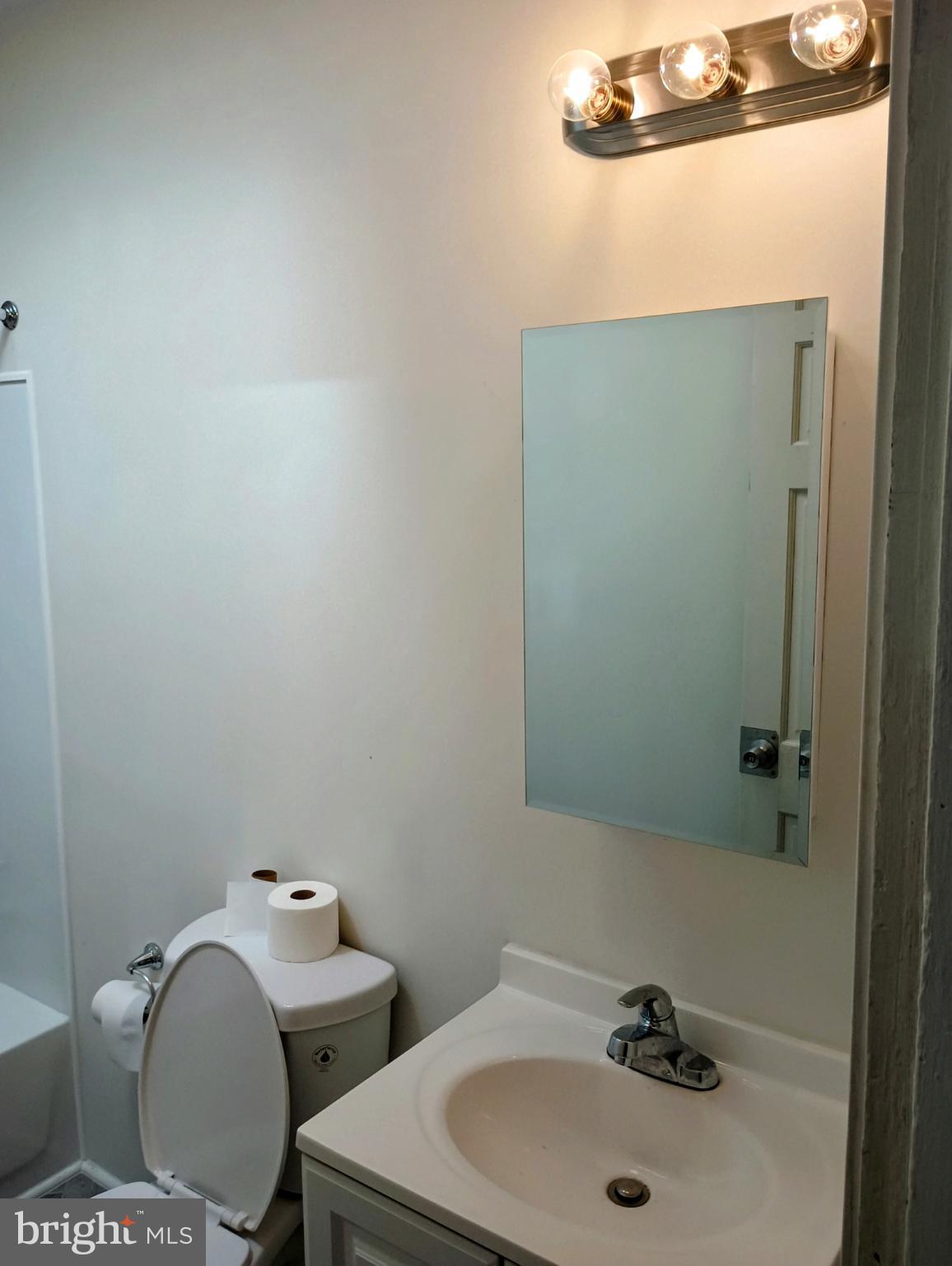5140 Ranstead Street Philadelphia, PA 19139 - Photo 21 of 24 a bathroom with a sink and mirror