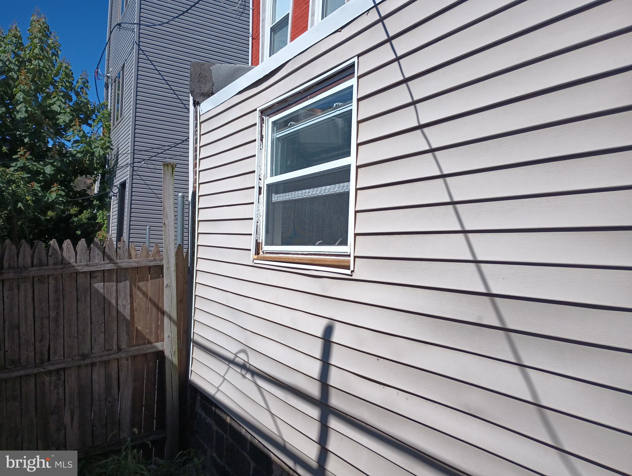 5140 Ranstead Street Philadelphia, PA 19139 - Photo 23 of 24 a view of a balcony with wooden floor and fence and a window