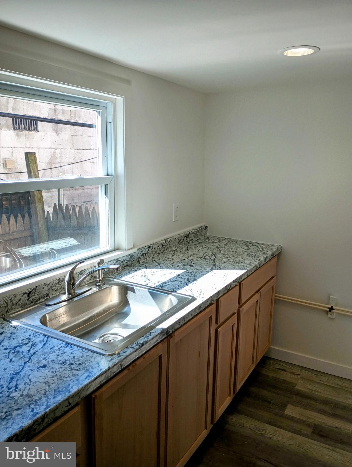 5140 Ranstead Street Philadelphia, PA 19139 - Photo 5 of 24 a kitchen with a sink and a window