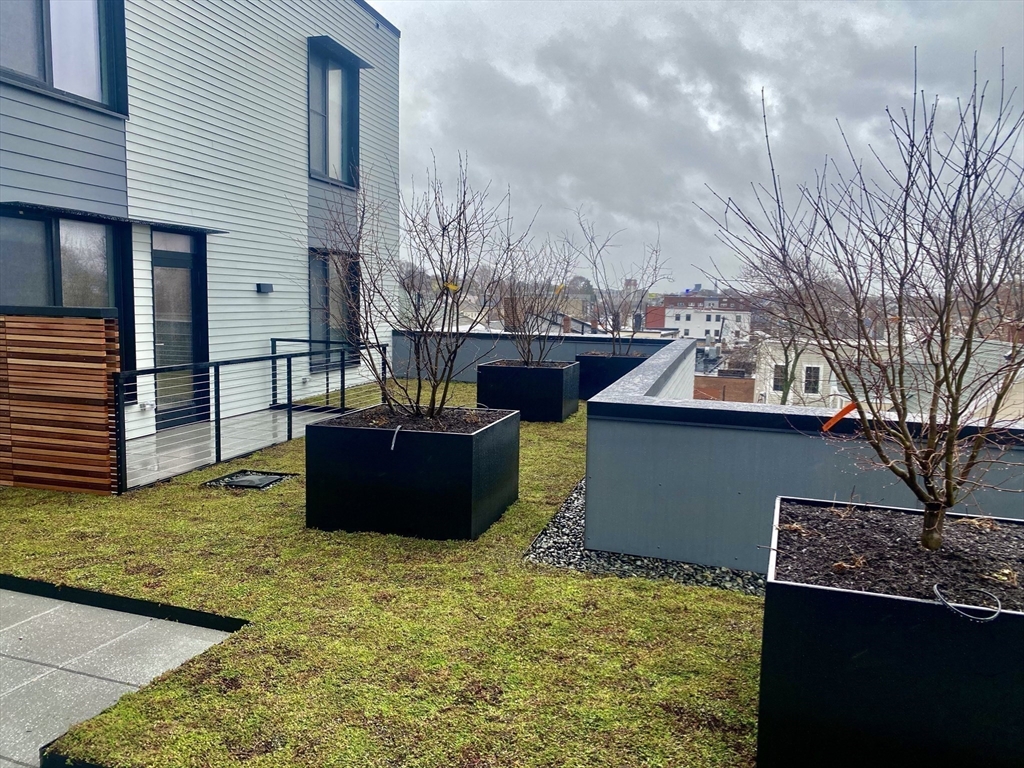 154 Broadway, Unit 409 Somerville, MA 02145 - Photo 18 of 18 a view of a terrace with a tub