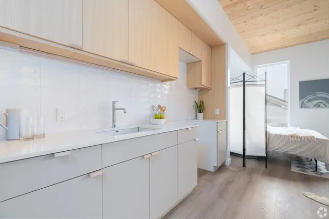 a kitchen with cabinets and a sink