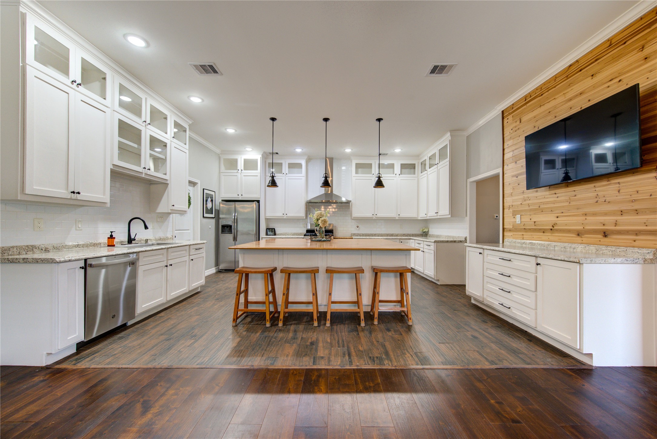 20531 Faye Tomball, TX 77377 - Photo 15 of 43 a kitchen with stainless steel appliances granite countertop a stove a sink a oven a dining table and chairs