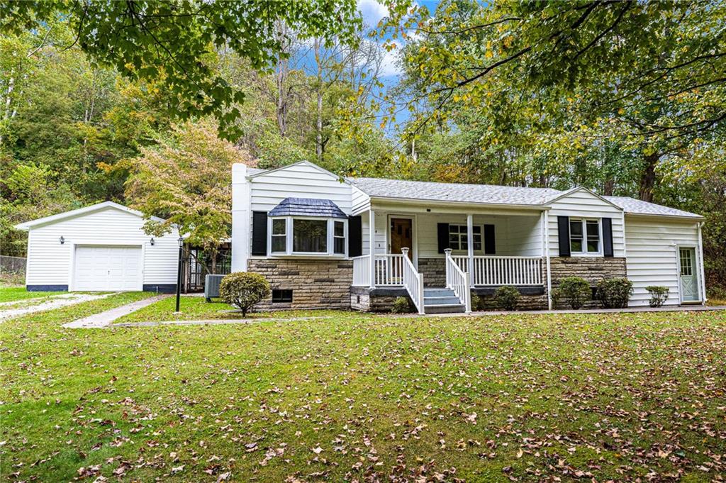 154 Hobbs Run Road Mount Morris, PA 15349 - Photo 1 of 32 a house view with a sitting space and garden