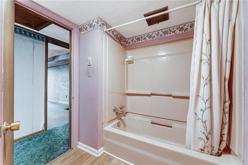 154 Hobbs Run Road Mount Morris, PA 15349 - Photo 15 of 32 a bathroom with a tub and shower