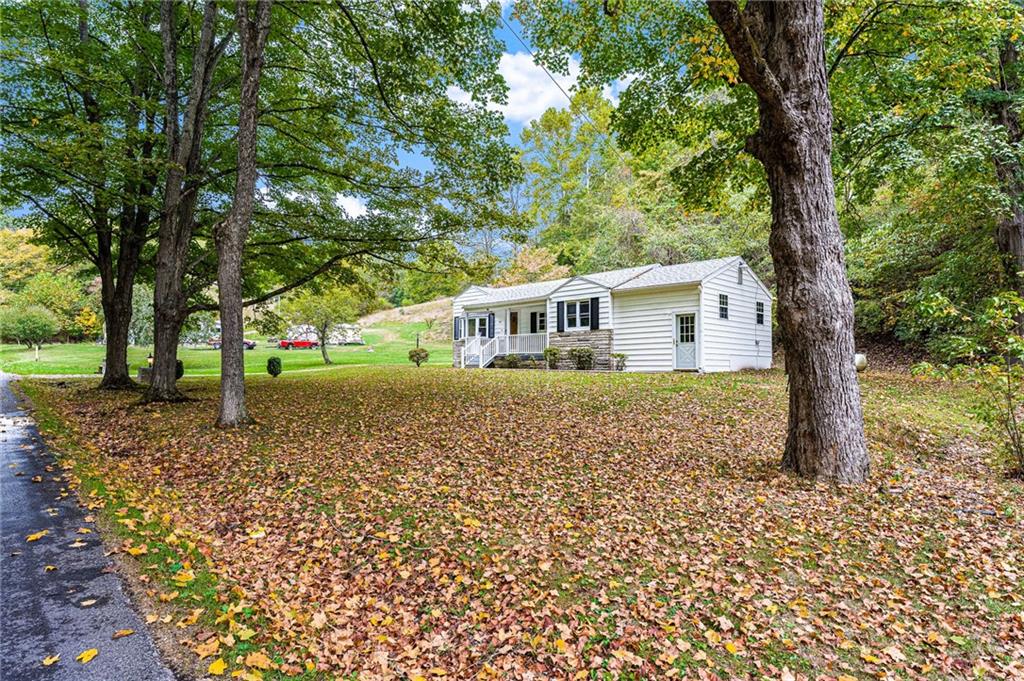 154 Hobbs Run Road Mount Morris, PA 15349 - Photo 3 of 32 a house with trees in front of it