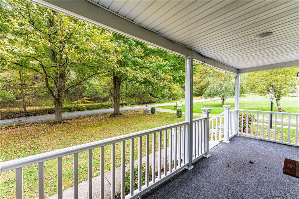 154 Hobbs Run Road Mount Morris, PA 15349 - Photo 5 of 32 a view of outdoor space with deck and trees
