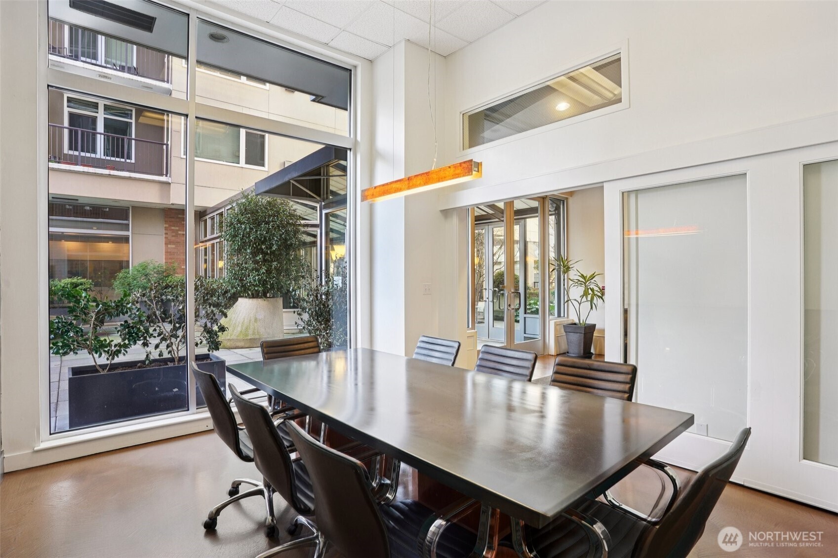 2801 1st Avenue, Unit 615 Seattle, WA 98121 - Photo 17 of 22 a view of a dining room with furniture window and outside view