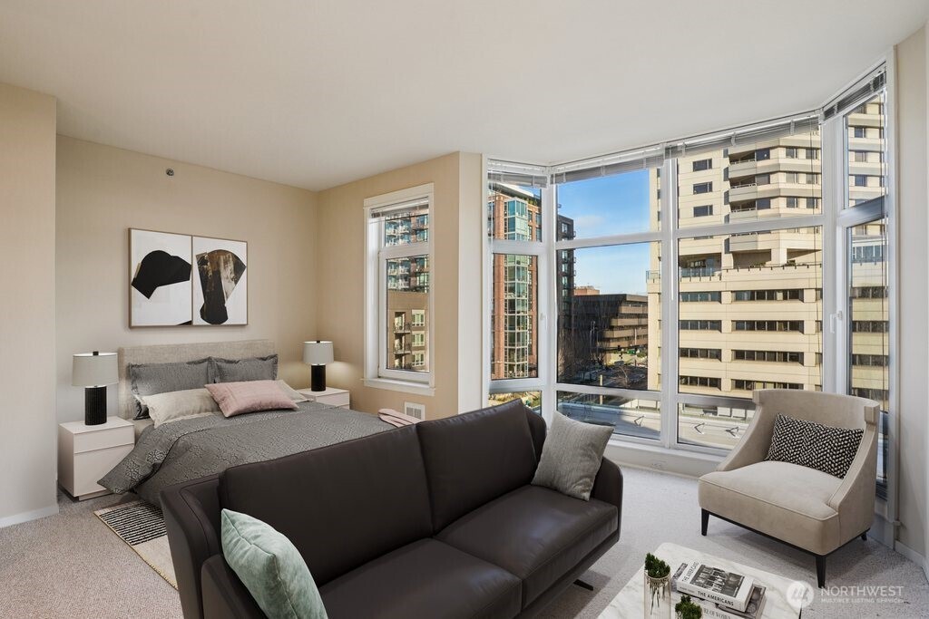 2801 1st Avenue, Unit 615 Seattle, WA 98121 - Photo 2 of 22 a bedroom with furniture and a large window