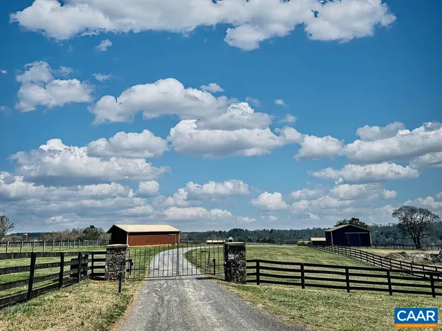 an aerial view of a golf course with parking space