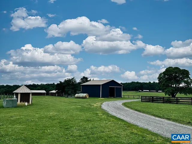 a view of house with backyard