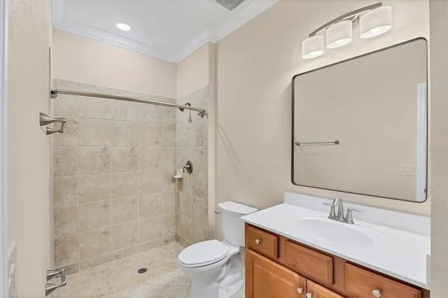 a view of a hallway with wooden floor and closet area