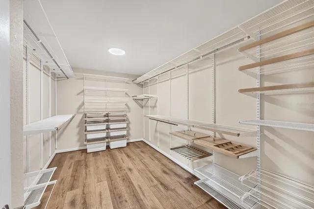 a bathroom with a double vanity sink mirror and shower