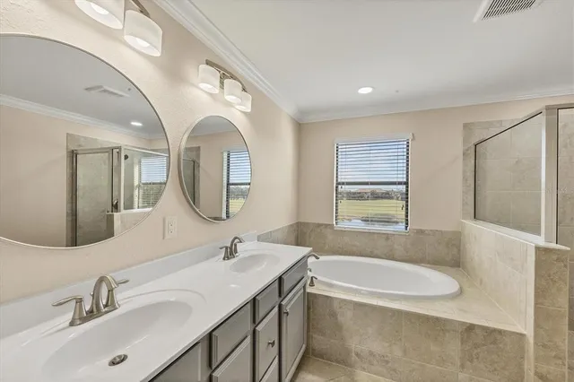 a view of a room with wooden floor and a ceiling fan