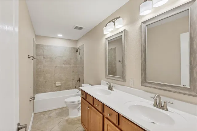 a bathroom with a sink toilet bathtub and shower