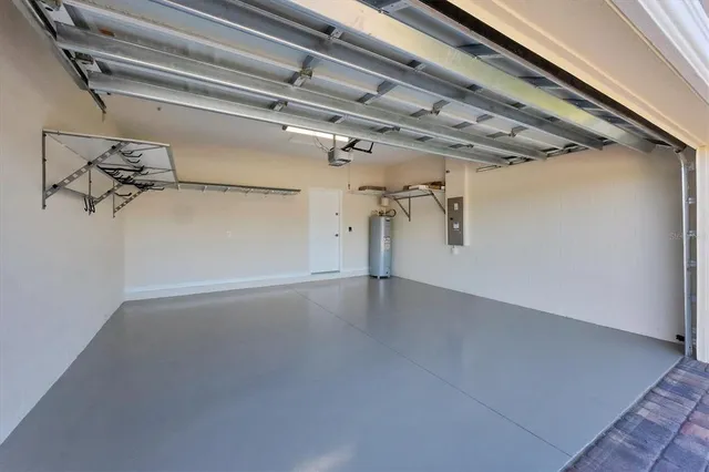 a front view of house with yard and lake view