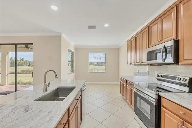 a view of a kitchen with a sink and a window