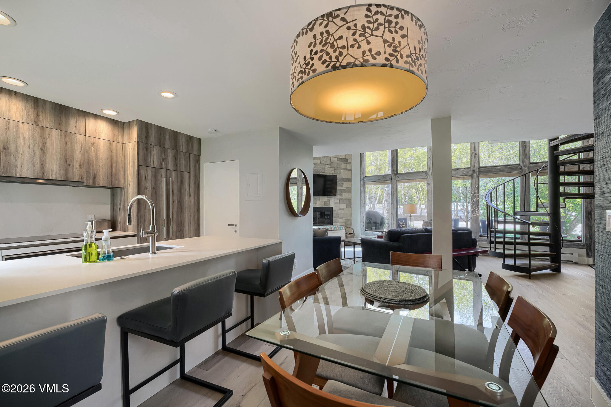 142 Eagle Drive, Unit C1 Avon, CO 81620 - Photo 6 of 20 a view of a dining room with furniture wooden floor and chandelier