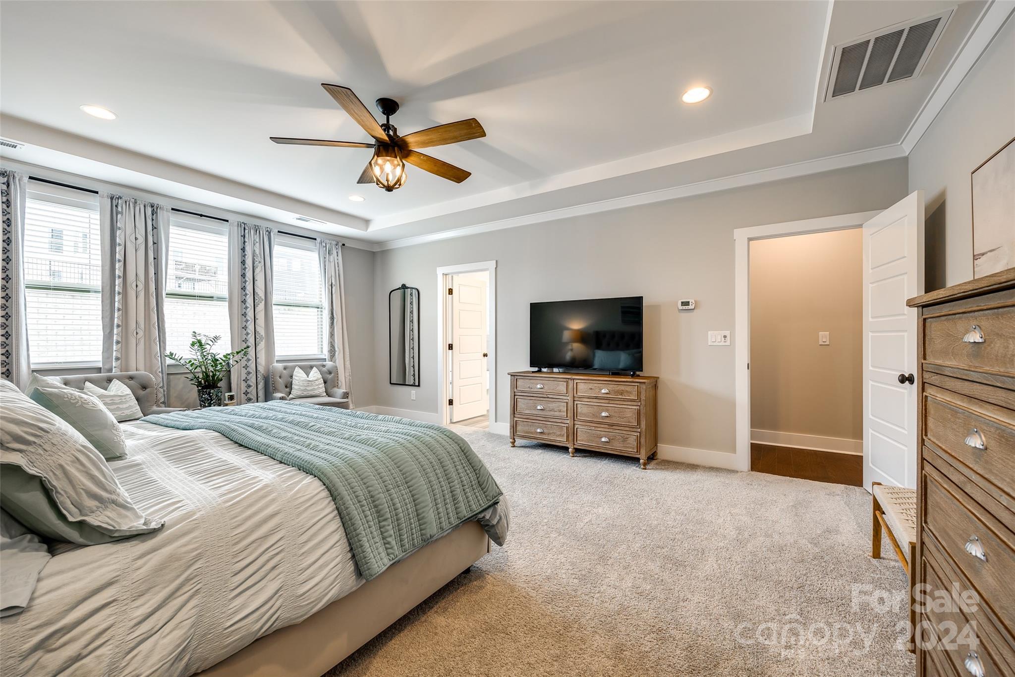 1174 Therns Ferry Drive Fort Mill, SC 29708 - Photo 26 of 48 a bedroom with a bed a flat screen tv and a couch