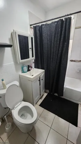 a bathroom with a sink a toilet a mirror and vanity