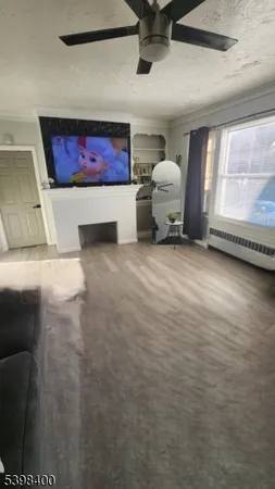 a view of a hallway with seating area