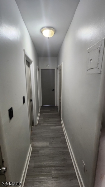 83 Vassar Avenue Newark, NJ 07112 - Photo 4 of 11 a view of a hallway with wooden floor