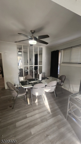 83 Vassar Avenue Newark, NJ 07112 - Photo 8 of 11 a living room with furniture a rug and a large window