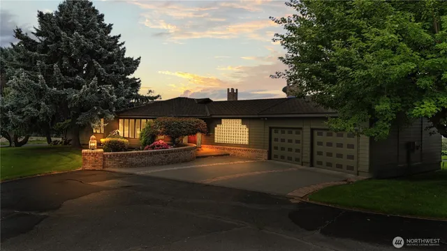 a view of a street with cars parked on the road