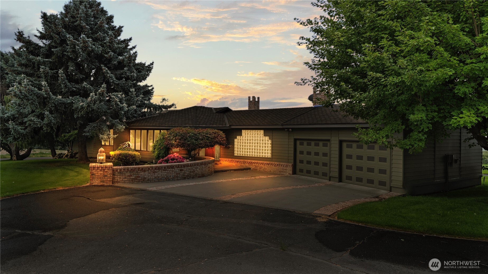 a view of a street with cars parked on the road