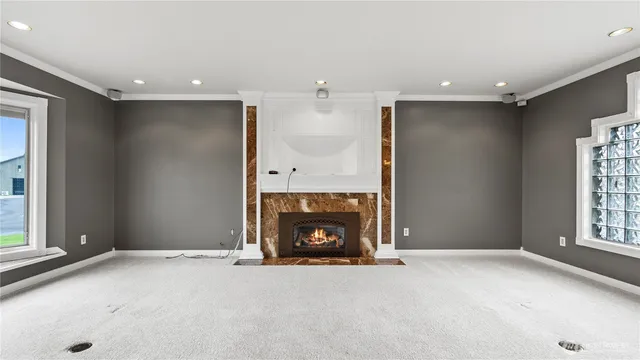 a view of an empty room with a fireplace