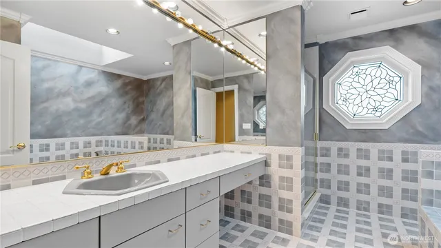 a bathroom with a sink and a mirror