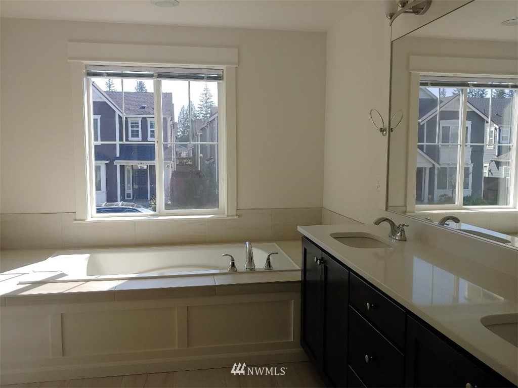 4422 185th Place Southeast Bothell, WA 98012 - Photo 13 of 28 a view of a granite countertop sink and a window