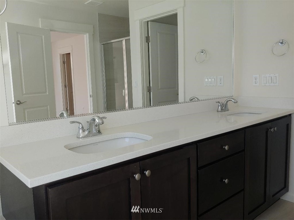 4422 185th Place Southeast Bothell, WA 98012 - Photo 14 of 28 a bathroom with a sink double vanity and a mirror