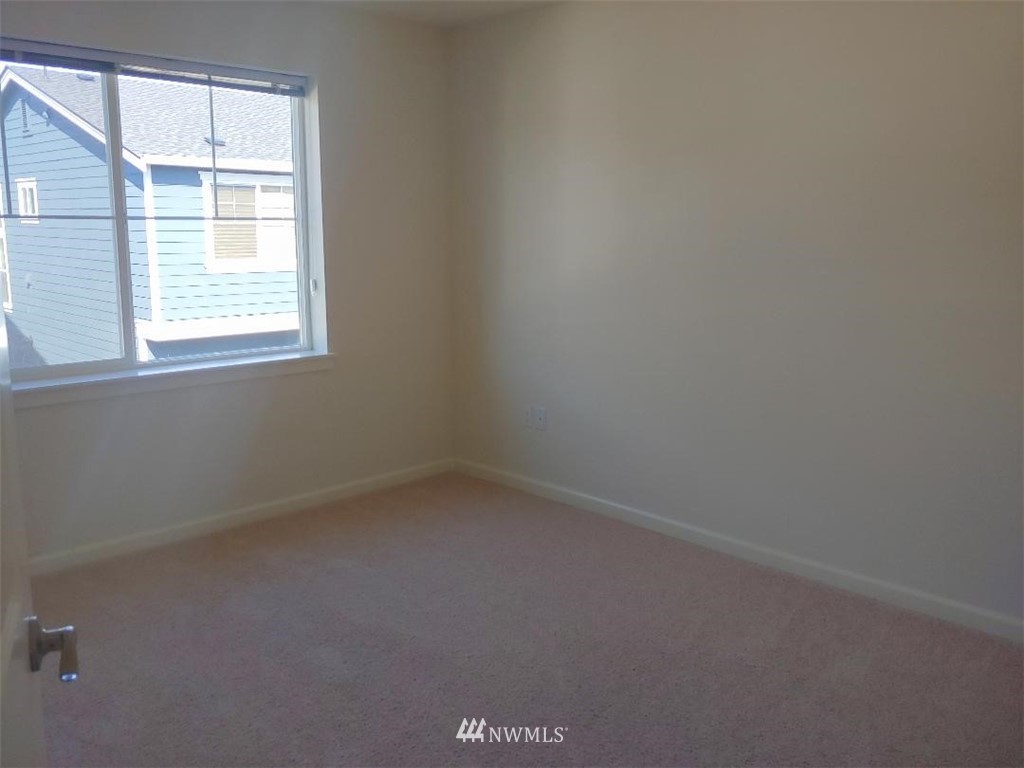 4422 185th Place Southeast Bothell, WA 98012 - Photo 18 of 28 an empty room with a window
