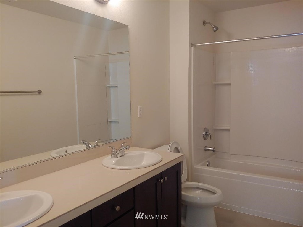 4422 185th Place Southeast Bothell, WA 98012 - Photo 19 of 28 a bathroom with a sink a toilet and shower
