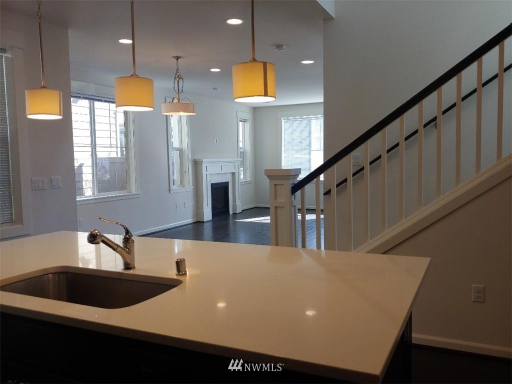 4422 185th Place Southeast Bothell, WA 98012 - Photo 7 of 28 a kitchen with a sink a counter top space and cabinets