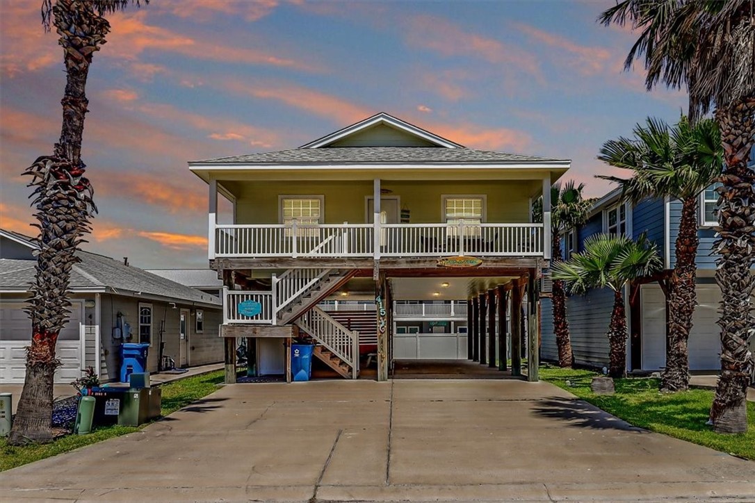 415 Spencers Landing Port Aransas, TX 78373 - Photo 1 of 40 a front view of a house with a porch
