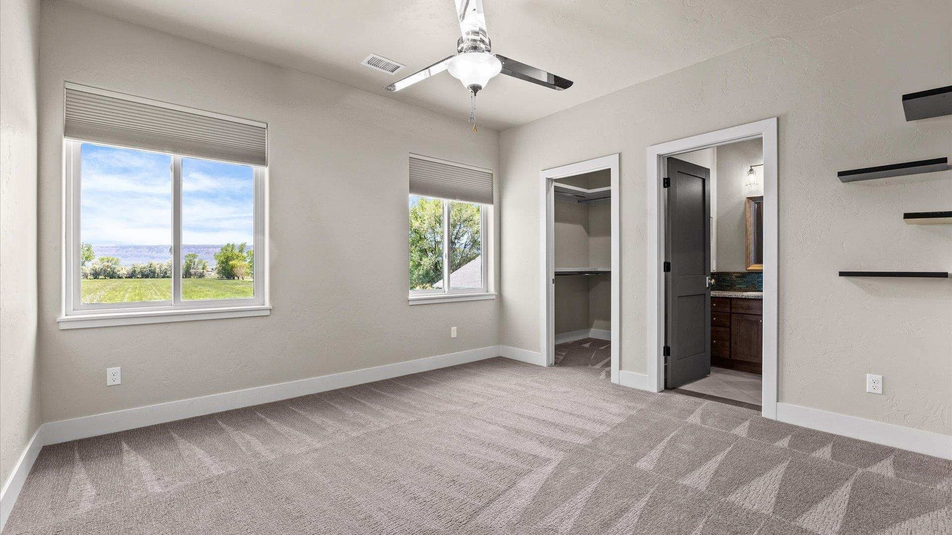 2041 J J 1/2 Road Fruita, CO 81521 - Photo 27 of 42 a view of an empty room with a window