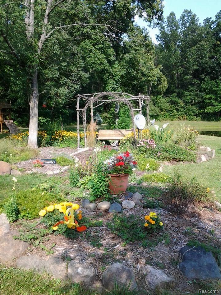 7180 McGuire Road Fenton, MI 48430 - Photo 43 of 50 Breathtaking landscaping!