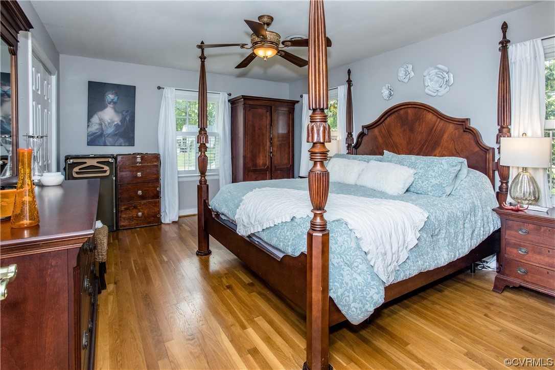 3911 Cresthill Road Chester, VA 23831 - Photo 15 of 50 a bedroom with a bed and wooden floor