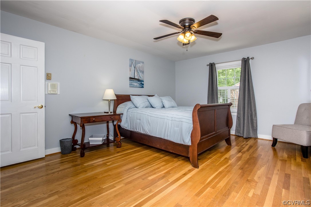 3911 Cresthill Road Chester, VA 23831 - Photo 26 of 50 a bedroom with a bed and a table in it