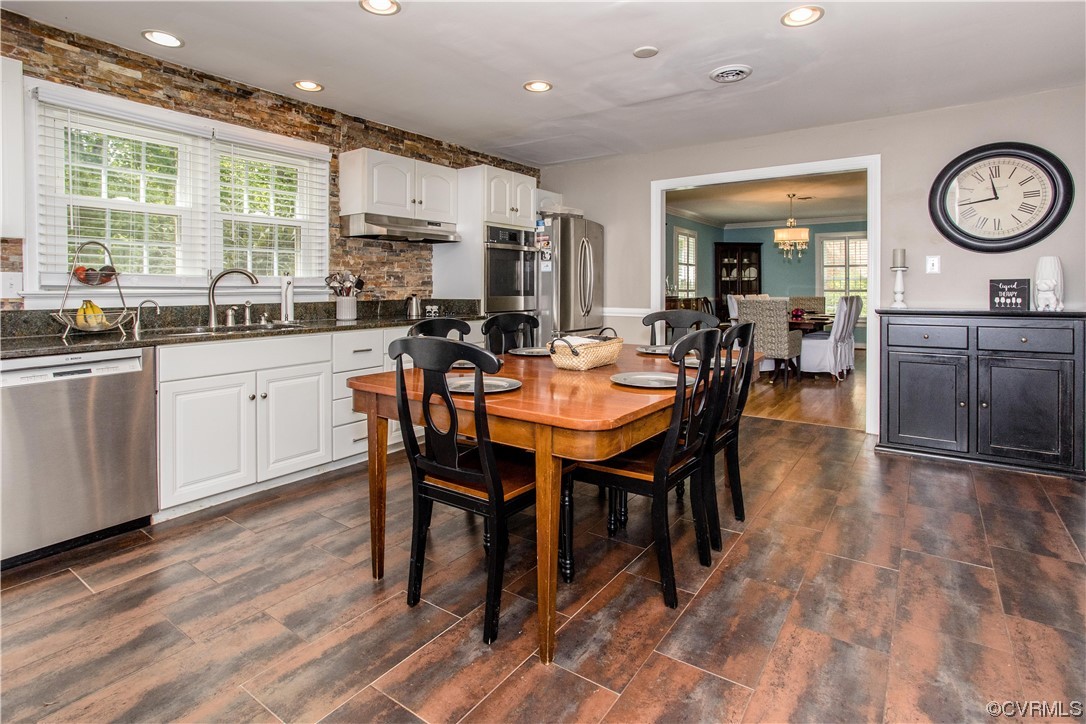 3911 Cresthill Road Chester, VA 23831 - Photo 34 of 50 a view of a dining room with furniture window and wooden floor