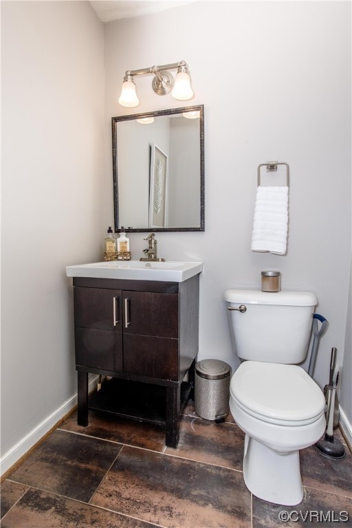3911 Cresthill Road Chester, VA 23831 - Photo 36 of 50 a bathroom with a toilet a sink and mirror
