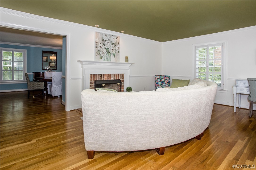 3911 Cresthill Road Chester, VA 23831 - Photo 41 of 50 a living room with couches and kitchen view with wooden floor