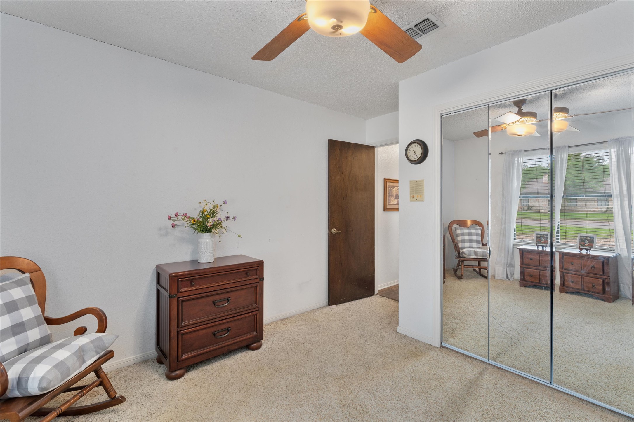 401 Drake Lane Taylor, TX 76574 - Photo 19 of 31 Bedroom featuring wall-to-wall carpeting, white painted walls, and a ceiling fan with light fixture