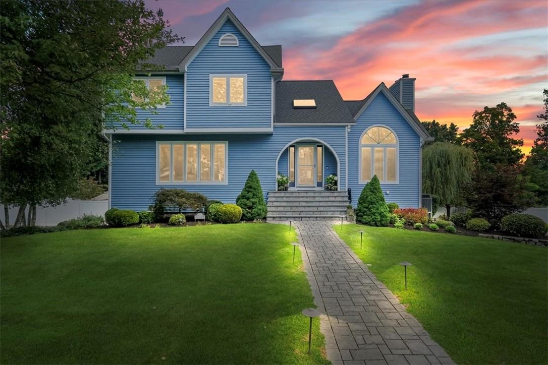 a front view of a house with a yard