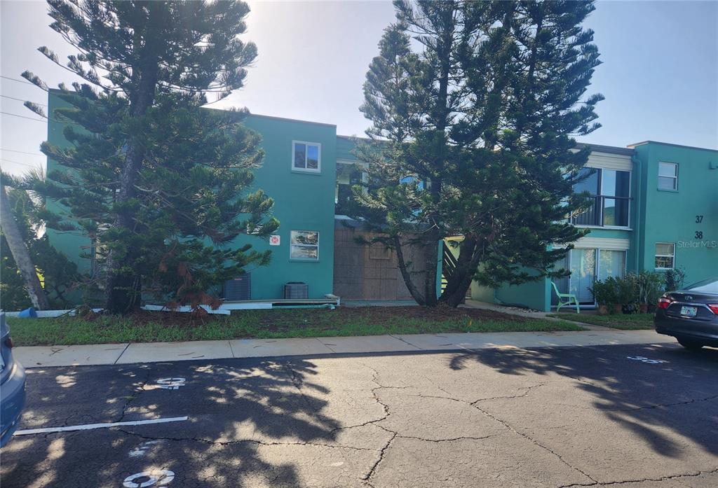 a view of a street with a building in the background