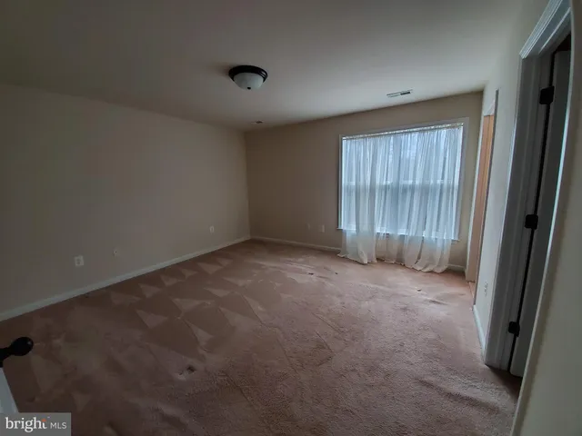 en empty room with windows